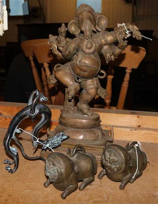 20C Indian bronze model of Ganesh, a pair of bronze lion dog mounts and a stylised model of a three-toed dragon